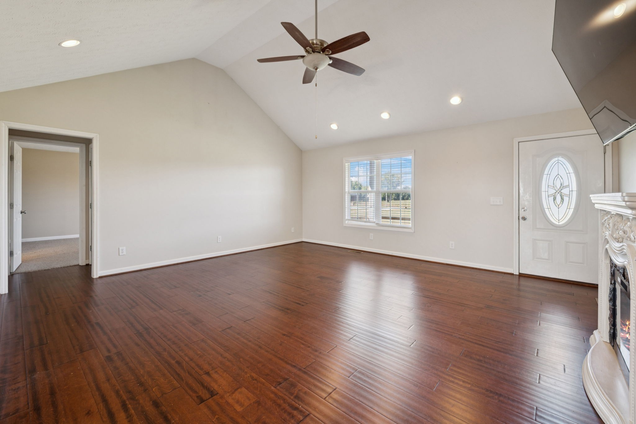 800 Williams Road Lafayette, TN 37083 - Photo 6 of 49 a view of a livingroom with a hardwood floor and a ceiling fan