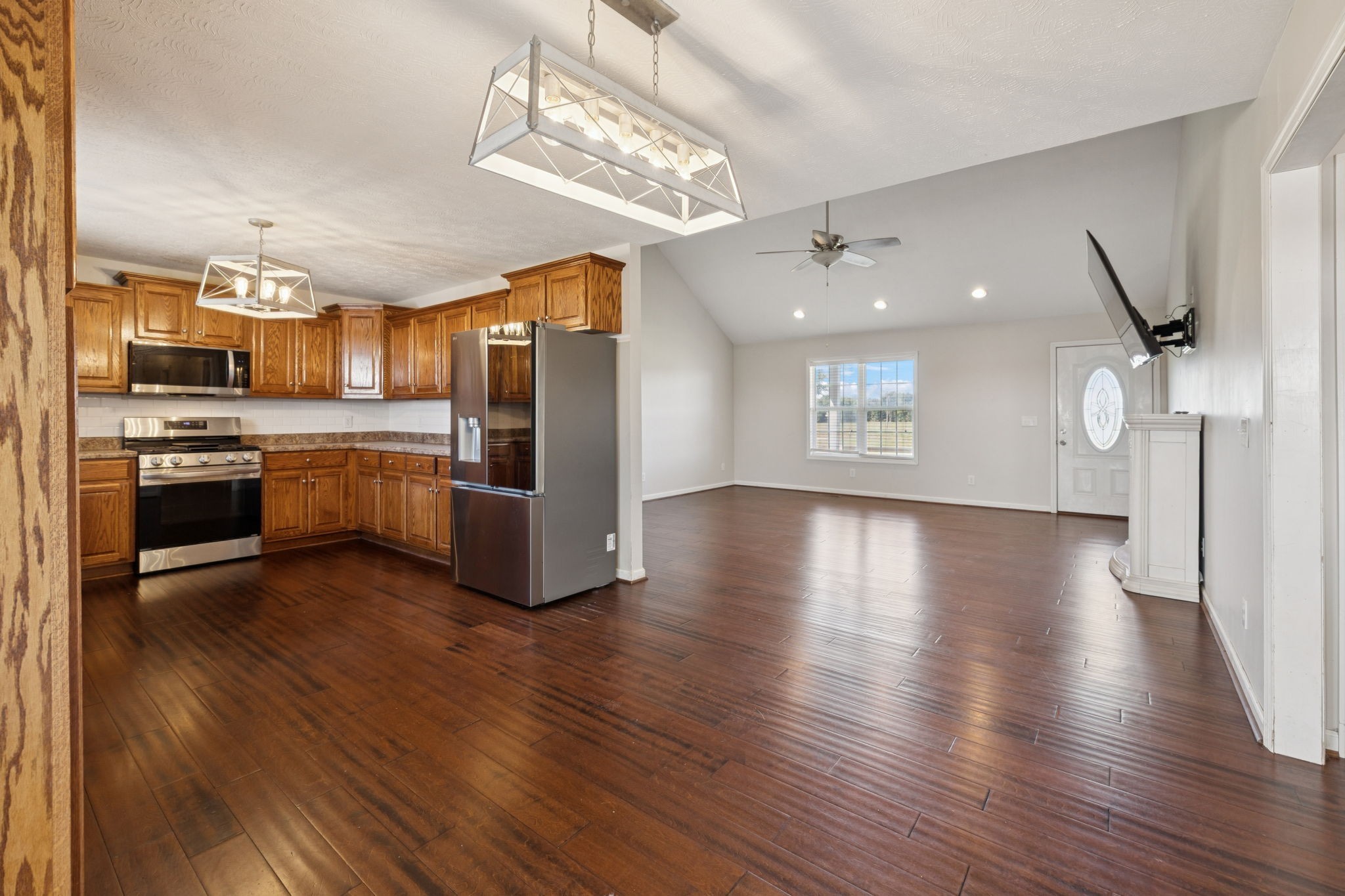 800 Williams Road Lafayette, TN 37083 - Photo 9 of 49 a view of a kitchen center island wooden floor and stainless steel appliances