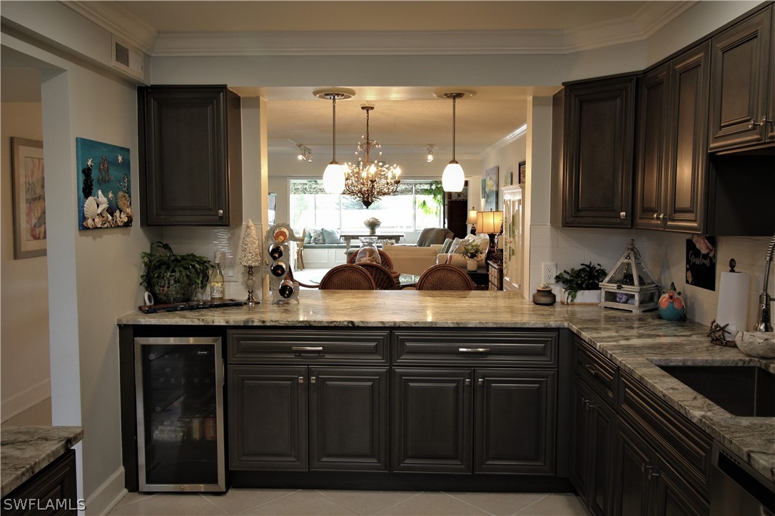 a kitchen with sink cabinets and appliances