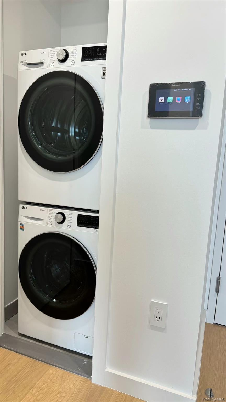 134-16 35th Avenue, Unit 6B Queens, NY 11354 - Photo 6 of 9 a utility room with dryer and washer