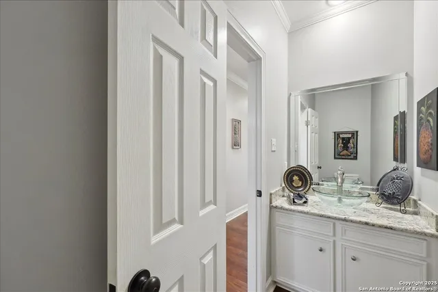 a bathroom with a double vanity sink and mirror