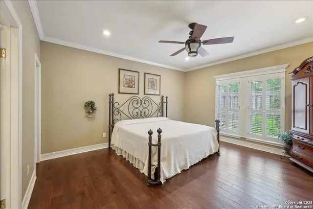 a bedroom with a large bed and a window