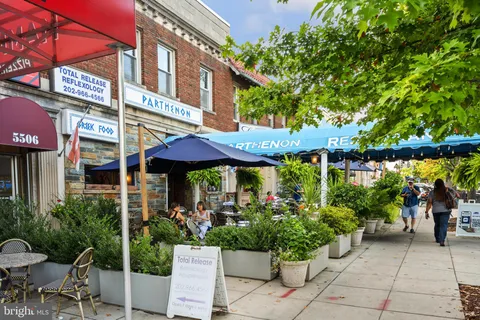 a sign that is on a brick wall