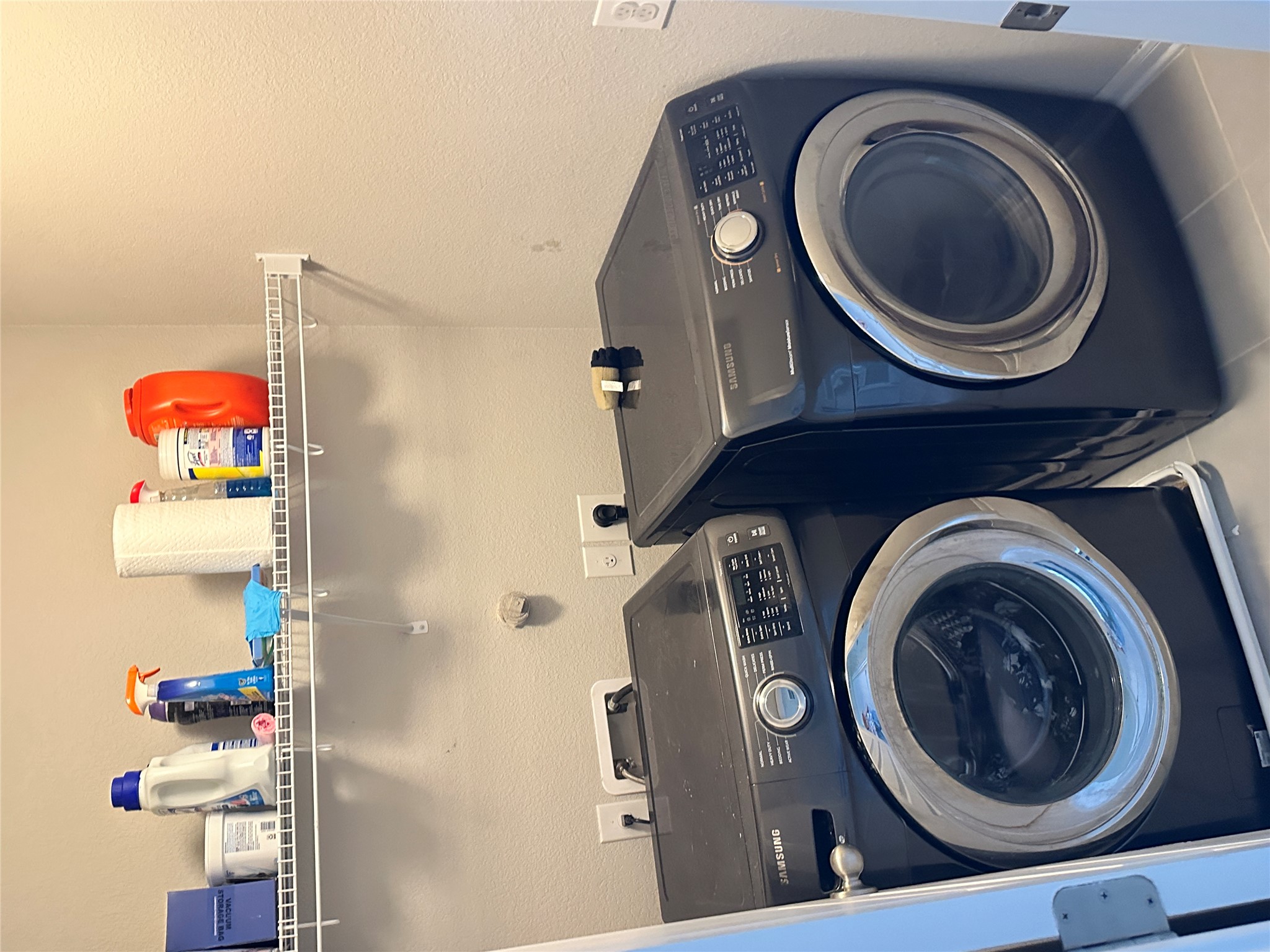1269 Nevarez Kyle, TX 78640 - Photo 18 of 27 Laundry area with separate washer and dryer and a textured wall