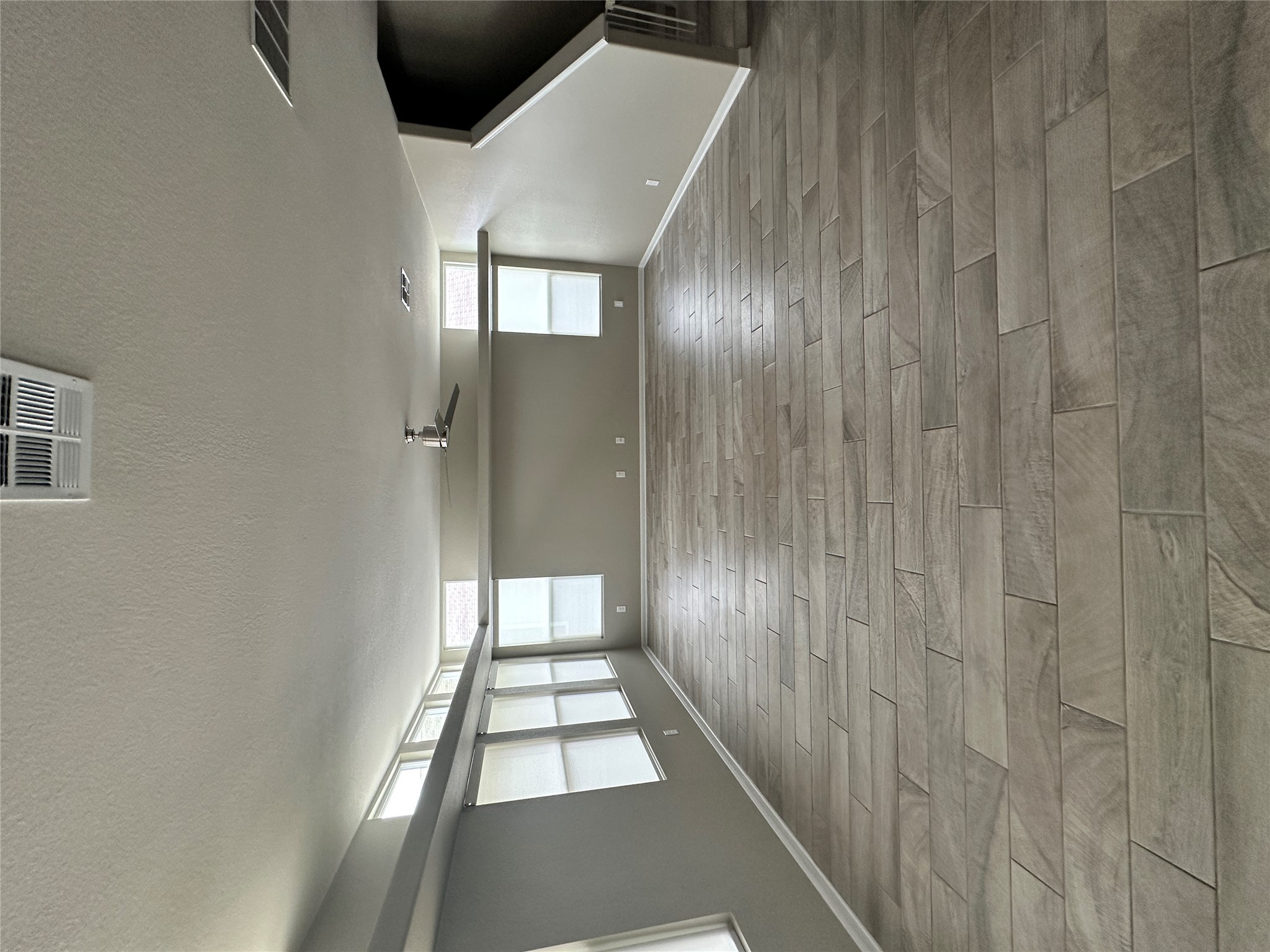 1269 Nevarez Kyle, TX 78640 - Photo 5 of 27 Spare room with a textured ceiling, ceiling fan, and wood finish floors