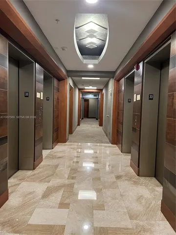 a view of a livingroom with furniture and an entryway