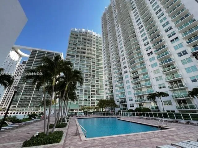 a view of a patio with a table and chairs