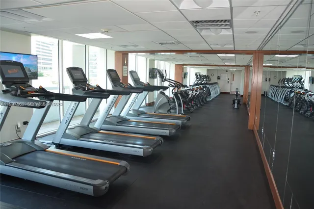 a room with wooden floor and furniture