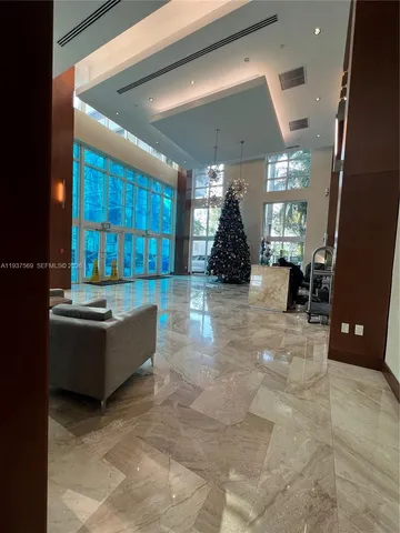 a view of an empty room with glass door