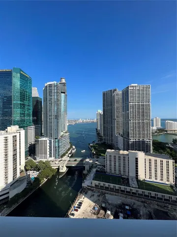 a kitchen with a stove cabinets and a refrigerator