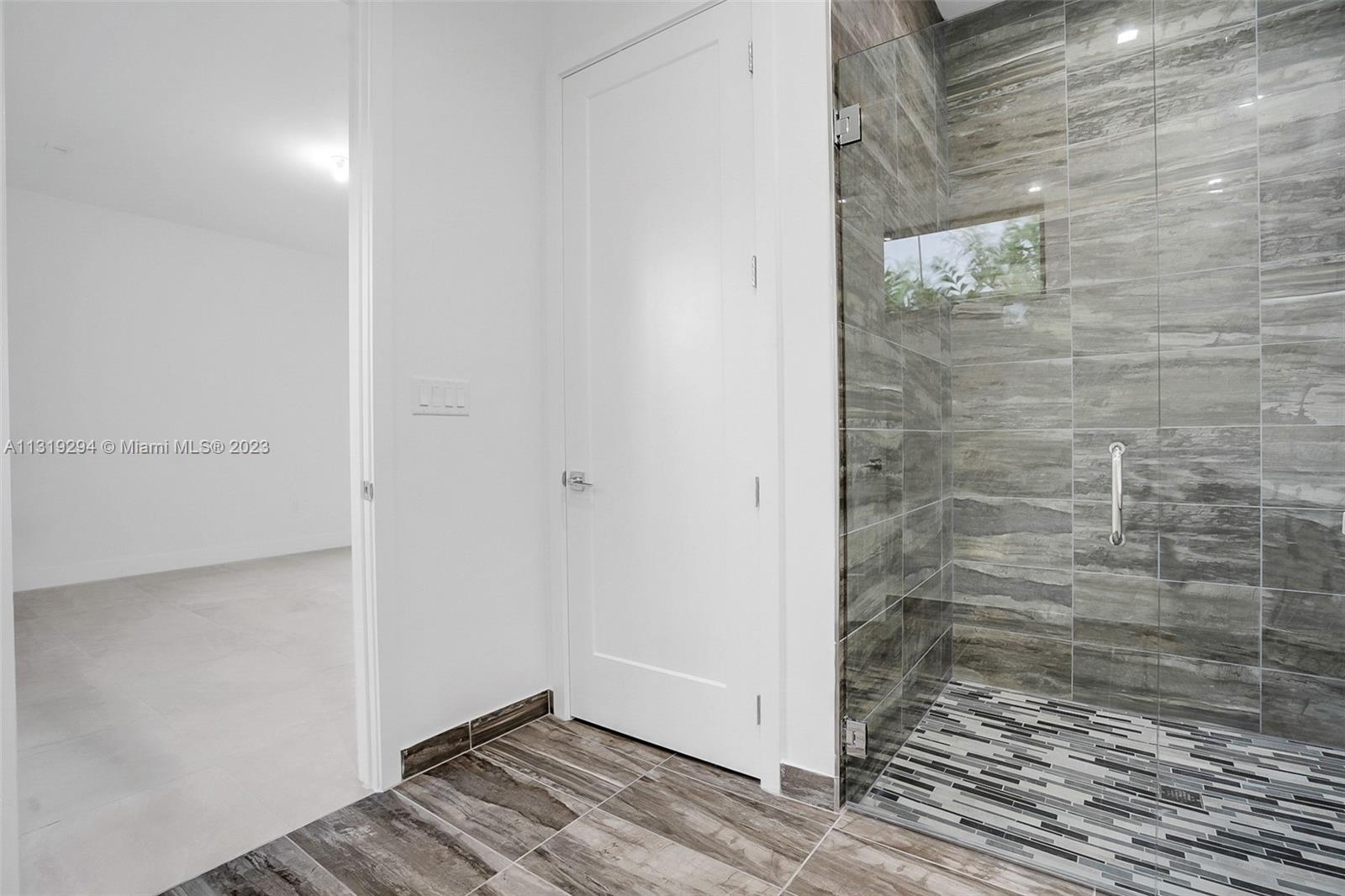 Doral Doral, FL 33166 - Photo 11 of 42 a bathroom with a shower