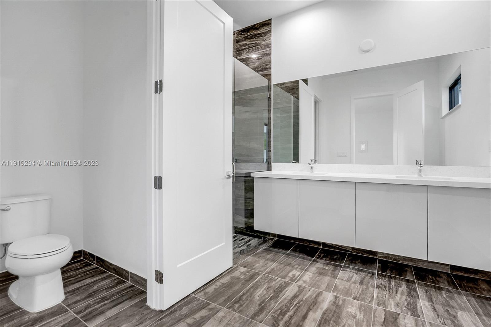 Doral Doral, FL 33166 - Photo 12 of 42 a bathroom with a sink and a toilet