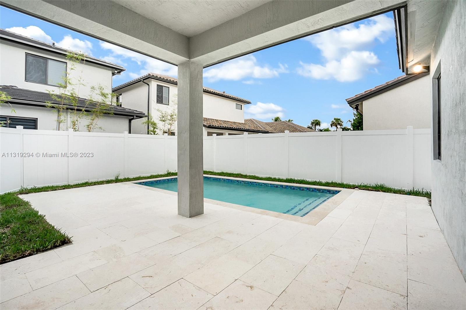 Doral Doral, FL 33166 - Photo 21 of 42 a view of backyard with large tree