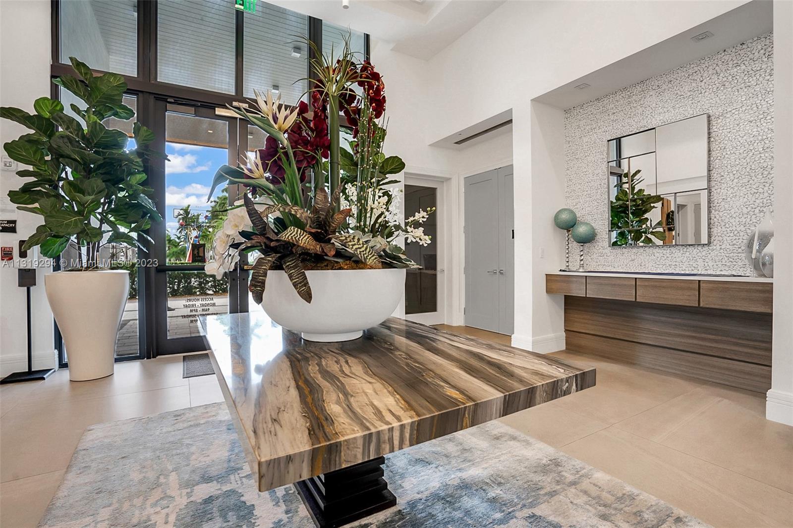 Doral Doral, FL 33166 - Photo 30 of 42 a living room with furniture and a potted plant