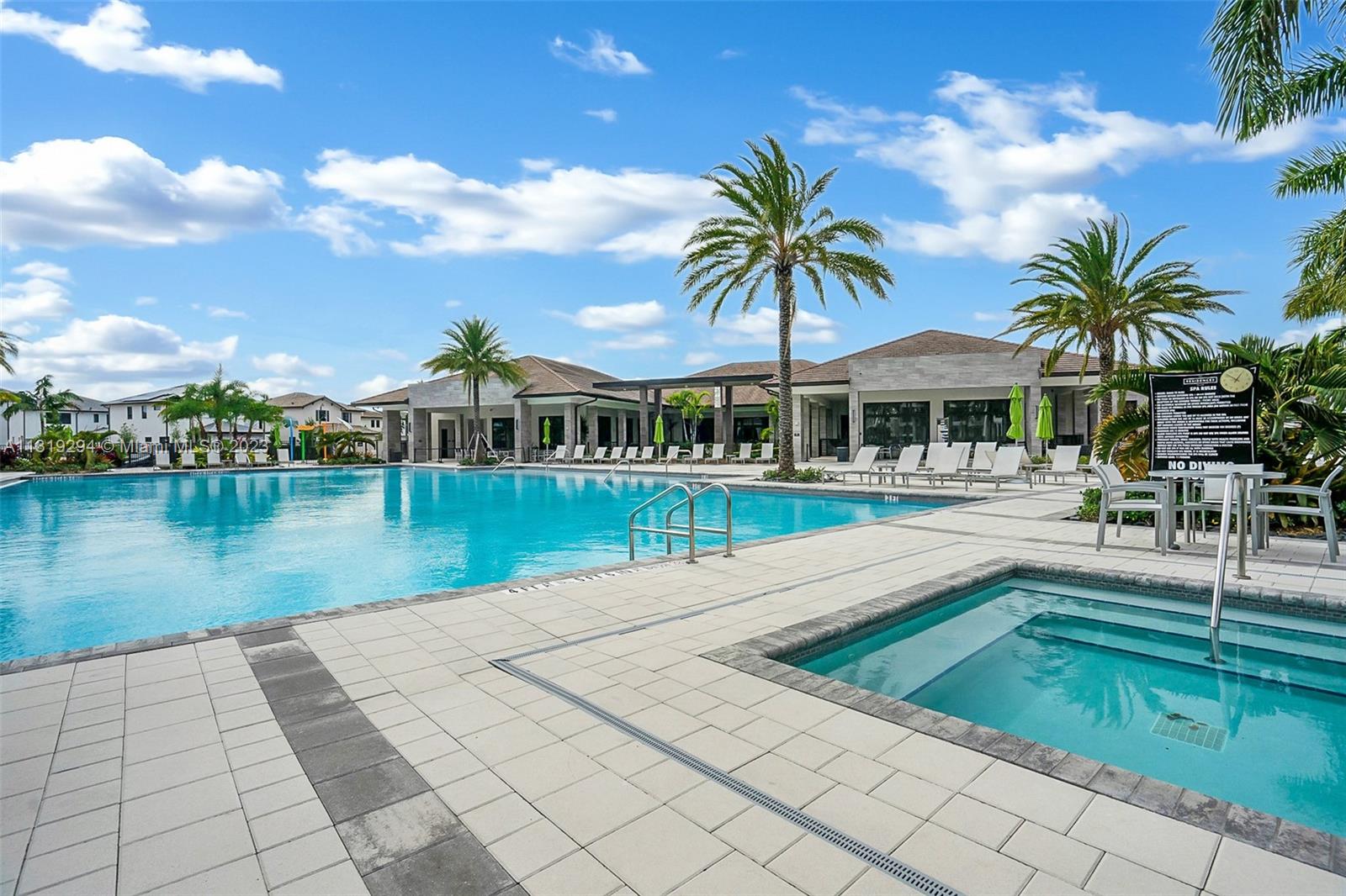 Doral Doral, FL 33166 - Photo 38 of 42 a view of a swimming pool with a garden