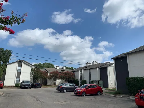 a view of parking space with parked cars