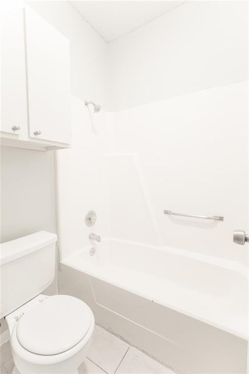 3707 Buffalo Springs Trail, Unit 301 Georgetown, TX 78628 - Photo 11 of 15 Bathroom featuring shower / bath combination and light tile patterned floors