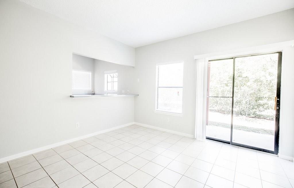 3707 Buffalo Springs Trail, Unit 301 Georgetown, TX 78628 - Photo 3 of 15 Unfurnished room with baseboards and light tile patterned flooring