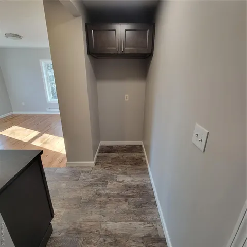 a view of a kitchen from the hallway