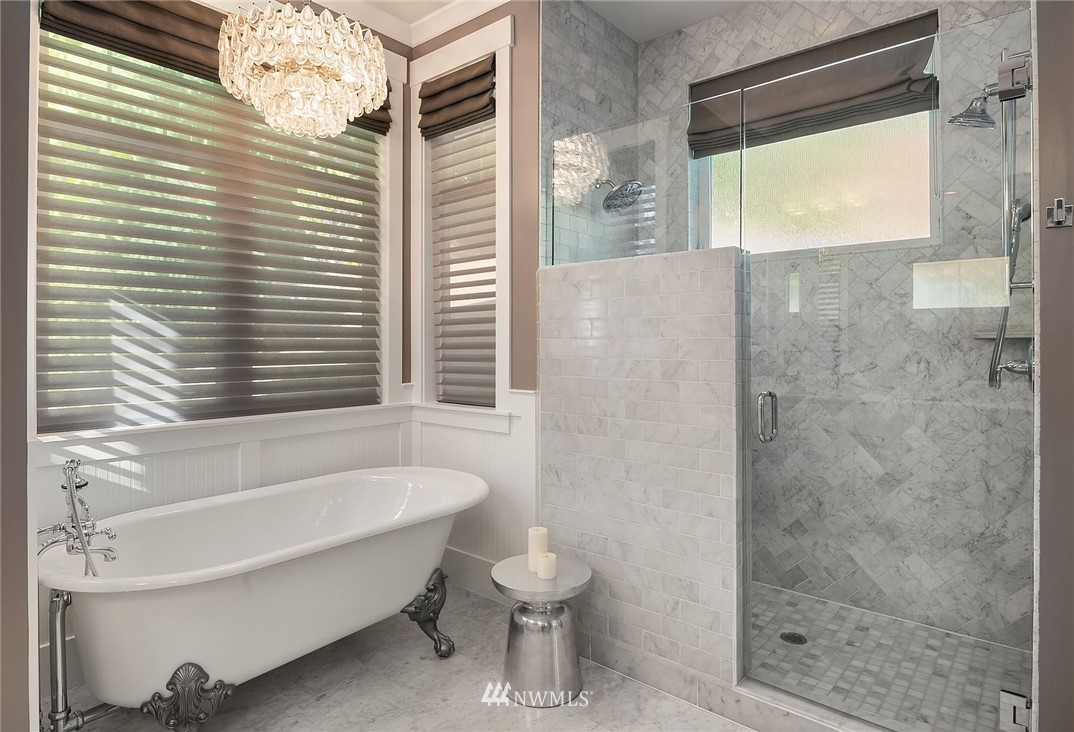 3112 Hunts Point Circle Hunts Point, WA 98004 - Photo 17 of 40 a bathroom with a bathtub and shower