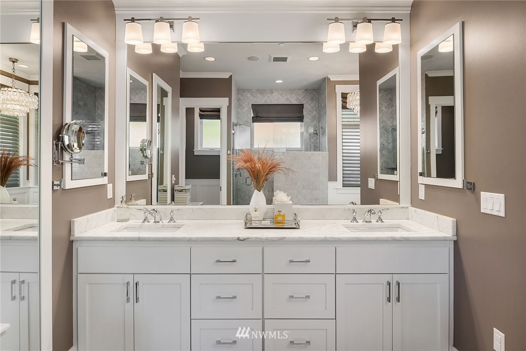 3112 Hunts Point Circle Hunts Point, WA 98004 - Photo 18 of 40 a bathroom with a sink vanity and mirror