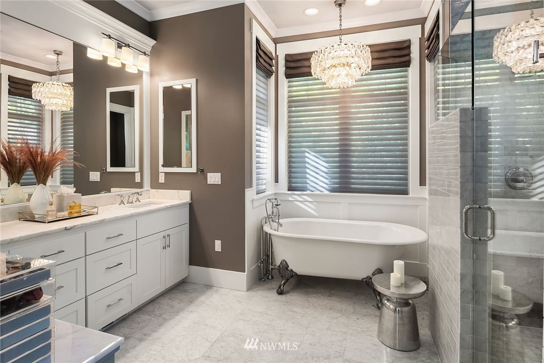 3112 Hunts Point Circle Hunts Point, WA 98004 - Photo 19 of 40 a bathroom with a double vanity sink mirror and bathtub