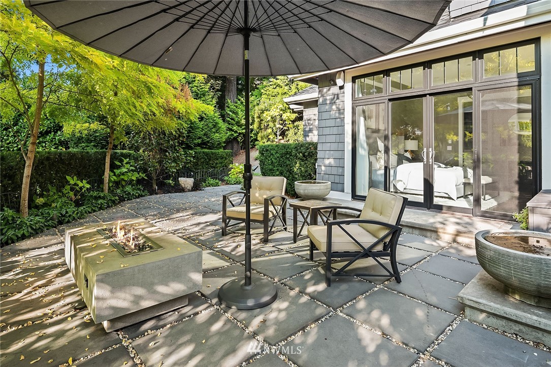 3112 Hunts Point Circle Hunts Point, WA 98004 - Photo 21 of 40 a patio with a patio table and chairs