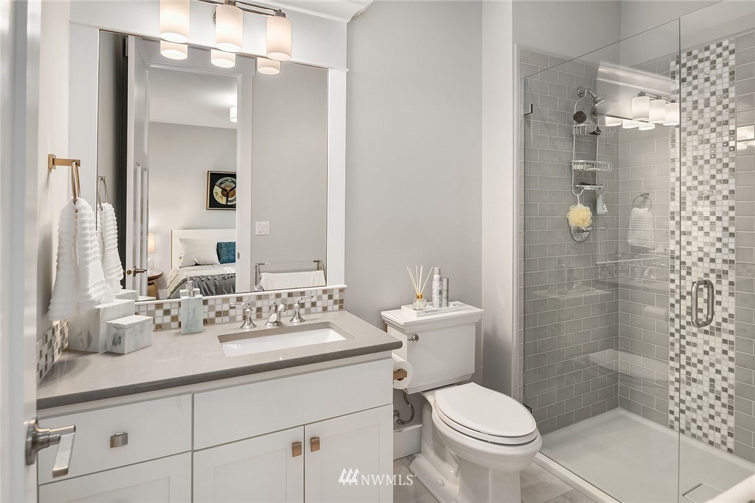 3112 Hunts Point Circle Hunts Point, WA 98004 - Photo 23 of 40 a bathroom with a sink toilet and shower