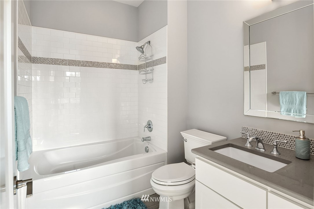 3112 Hunts Point Circle Hunts Point, WA 98004 - Photo 26 of 40 a bathroom with a sink toilet vanity and shower