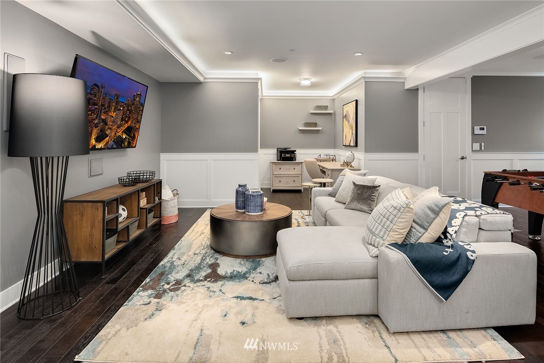 3112 Hunts Point Circle Hunts Point, WA 98004 - Photo 27 of 40 a living room with furniture and a flat screen tv