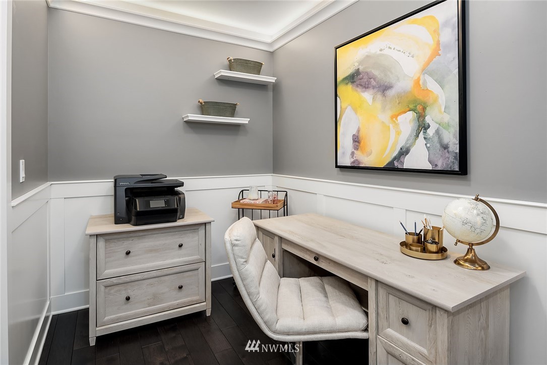 3112 Hunts Point Circle Hunts Point, WA 98004 - Photo 30 of 40 a kitchen with a sink a stove and a painting on the wall