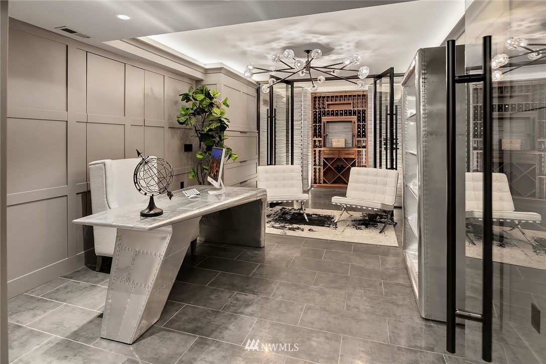 3112 Hunts Point Circle Hunts Point, WA 98004 - Photo 32 of 40 a living room with furniture a chandelier and a table