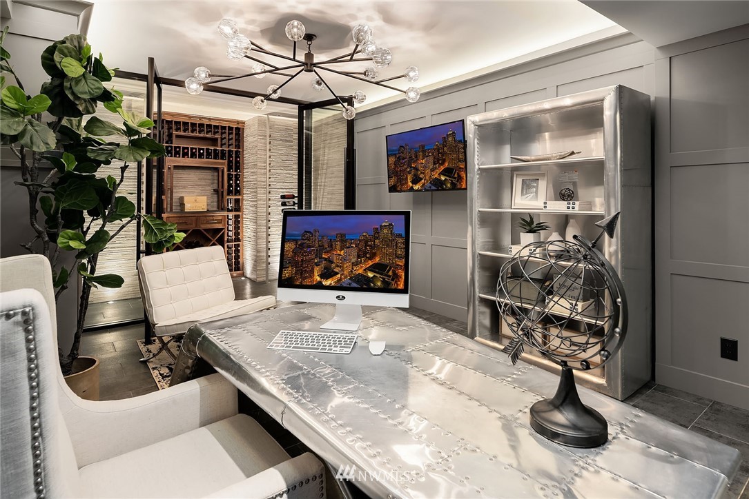 3112 Hunts Point Circle Hunts Point, WA 98004 - Photo 33 of 40 a living room with furniture a potted plant and a fireplace