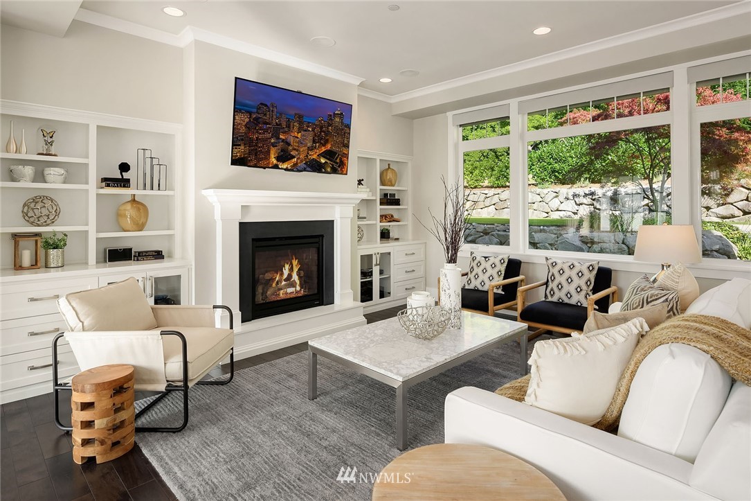 3112 Hunts Point Circle Hunts Point, WA 98004 - Photo 5 of 40 a living room with furniture fireplace and large window