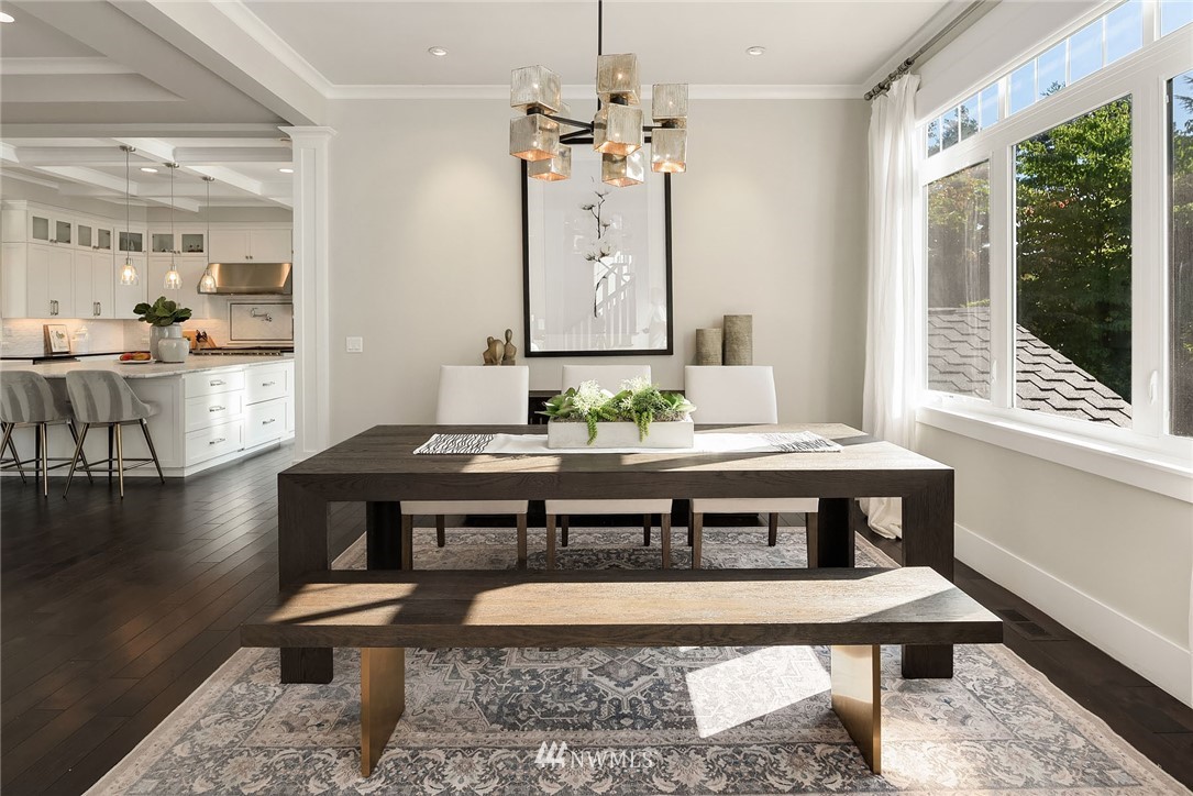 3112 Hunts Point Circle Hunts Point, WA 98004 - Photo 7 of 40 a view of a dining room with furniture window and wooden floor
