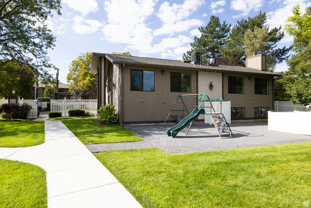 6936 South 775 East, Unit B Midvale, UT 84047 - Photo 29 of 33 View of front facade featuring a playground and a chimney