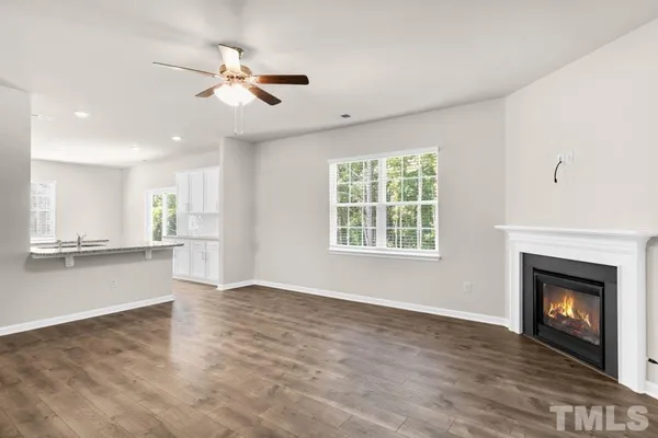 an view of fireplace with window in living room