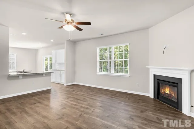 an view of fireplace with window in living room