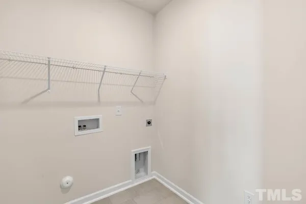 an empty room with a window and a ceiling fan