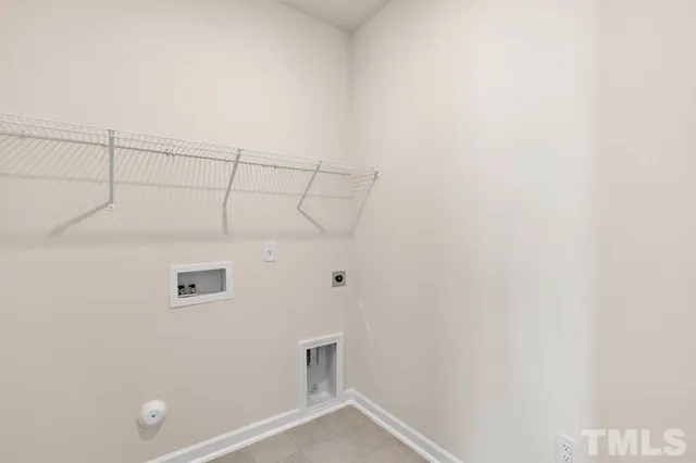 an empty room with a window and a ceiling fan