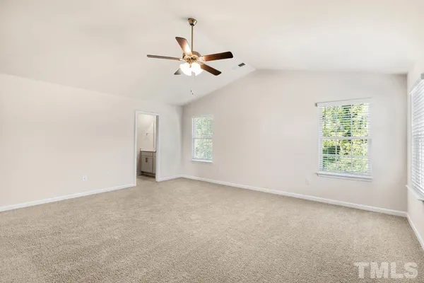 a bathroom with a double vanity sink mirror and shower