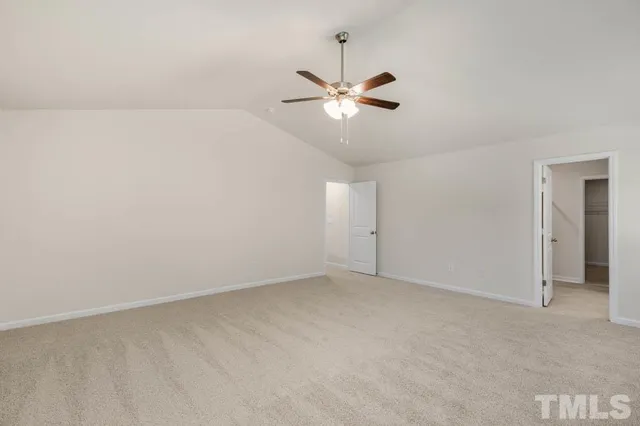 a bathroom with a sink a toilet and a large mirror