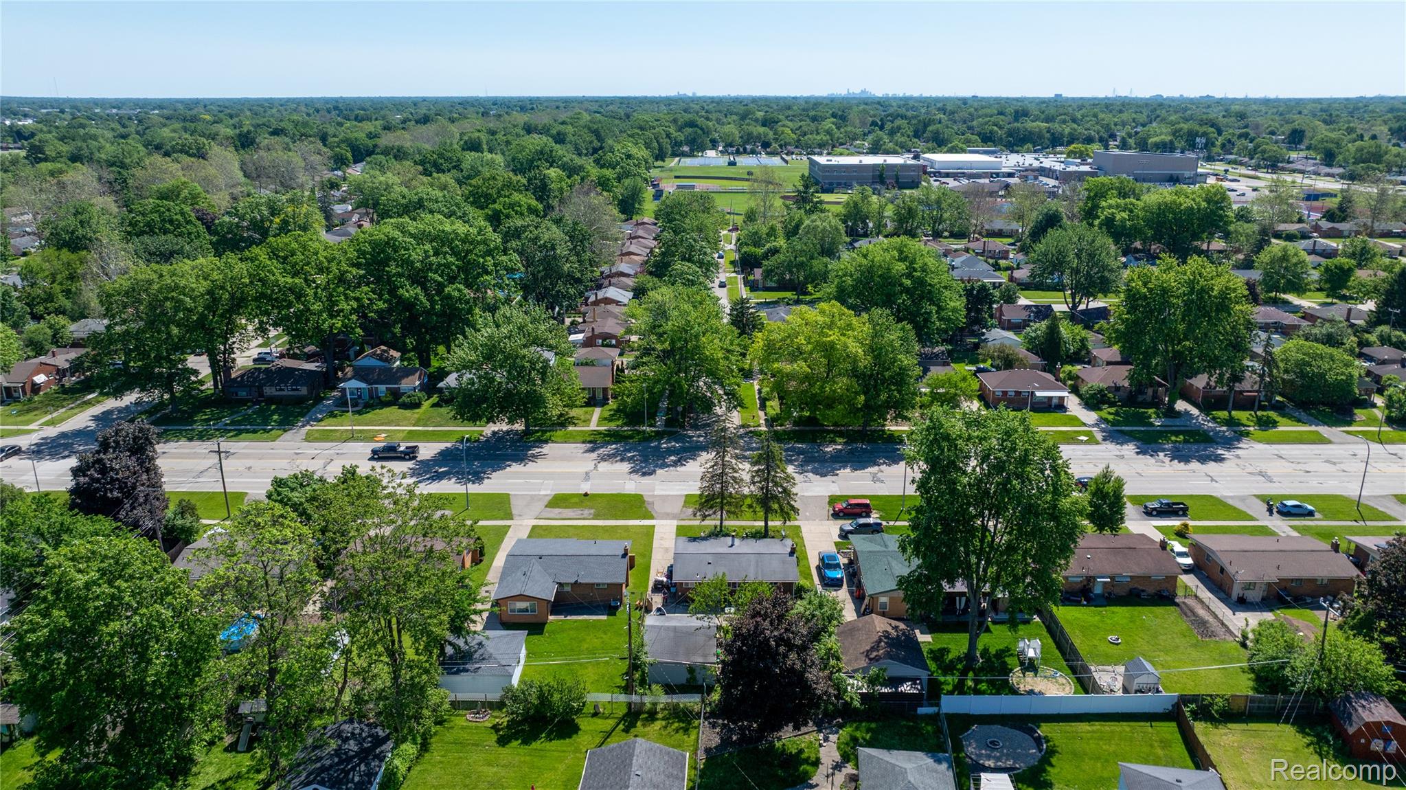 9101 Merriman Road Livonia, MI 48150 - Photo 7 of 24 Residential neighborhood featuring mature trees, paved streets, and a variety of single-story homes