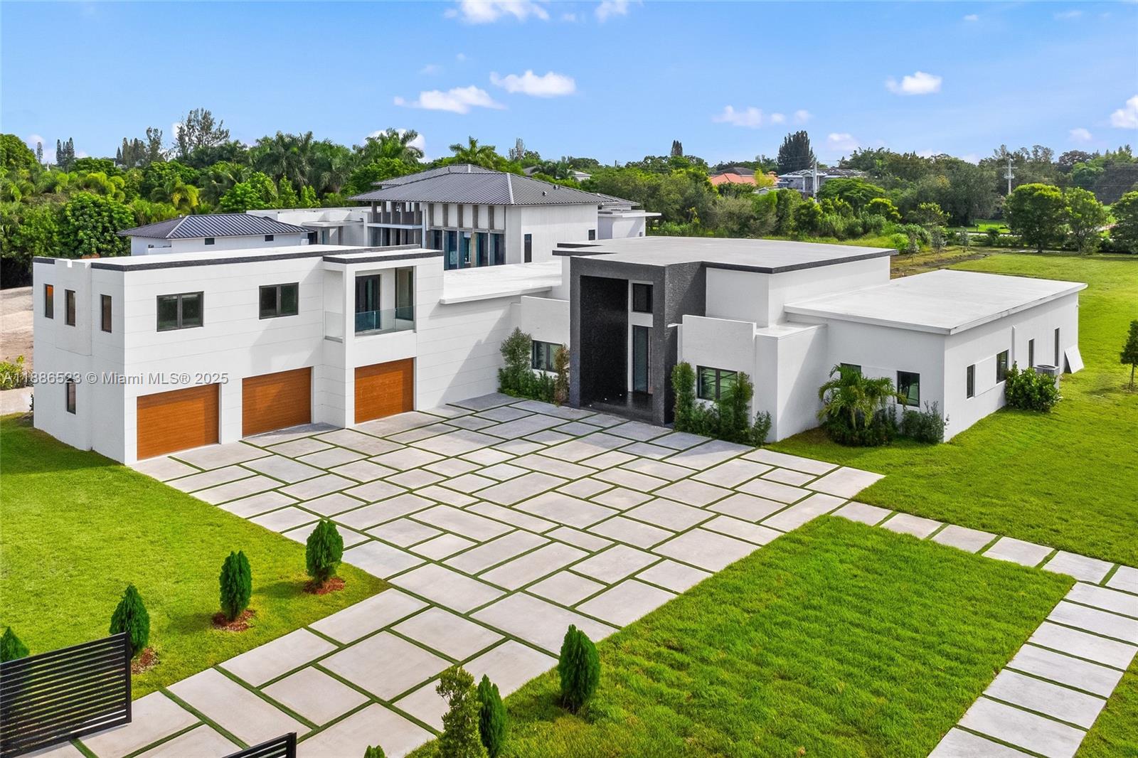 17301 Southwest 52nd Court Southwest Ranches, FL 33331 - Photo 1 of 47 a view of a house with a yard and potted plants