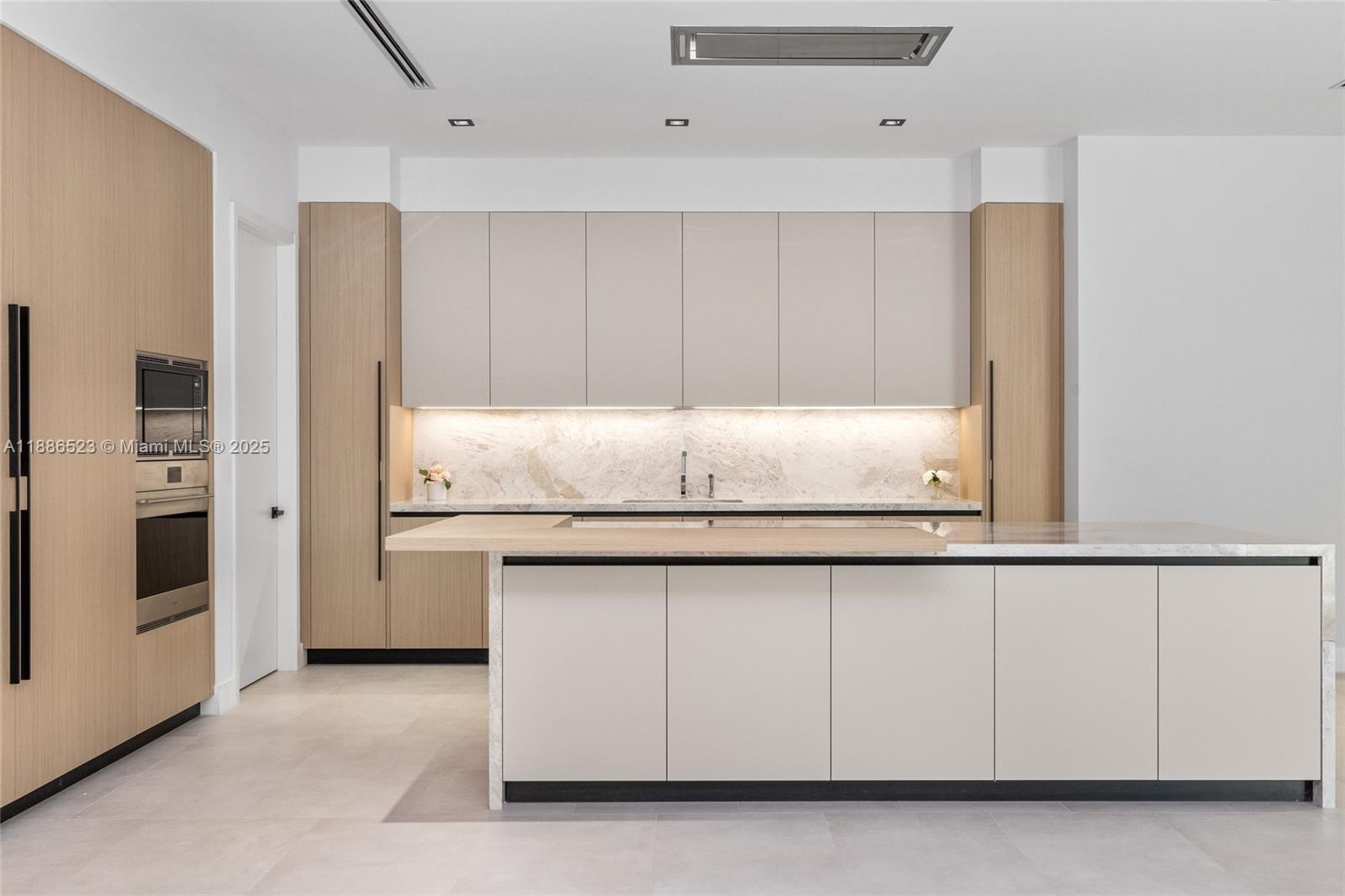 17301 Southwest 52nd Court Southwest Ranches, FL 33331 - Photo 13 of 47 a kitchen with granite countertop white cabinets and stainless steel appliances