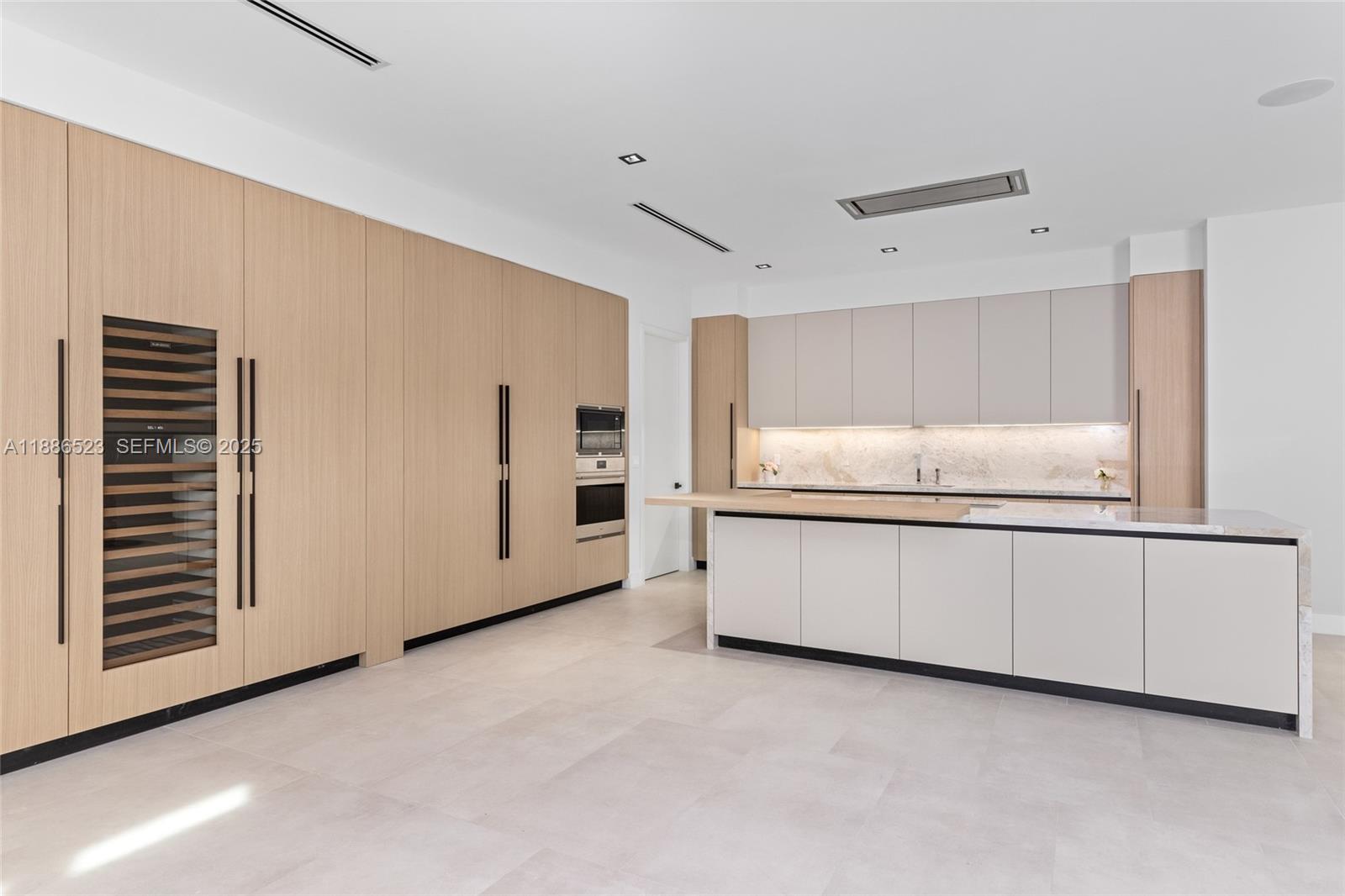 17301 Southwest 52nd Court Southwest Ranches, FL 33331 - Photo 14 of 47 a kitchen with granite countertop white cabinets and white appliances