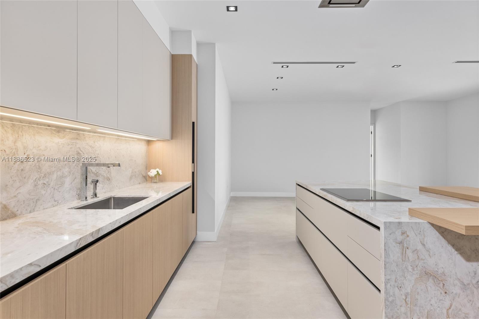 17301 Southwest 52nd Court Southwest Ranches, FL 33331 - Photo 16 of 47 a kitchen with a sink and a refrigerator