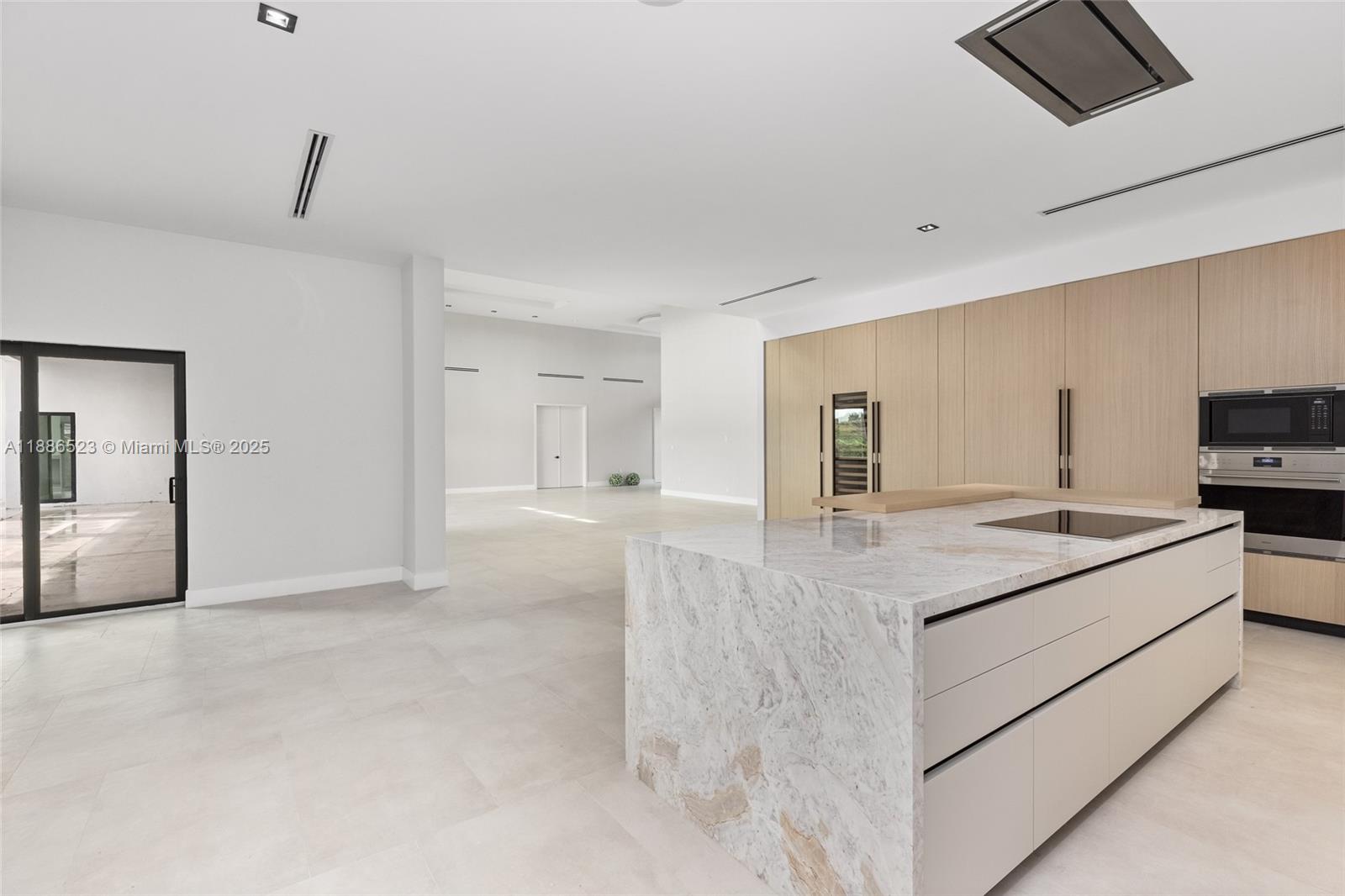 17301 Southwest 52nd Court Southwest Ranches, FL 33331 - Photo 18 of 47 a kitchen with stainless steel appliances a sink and a refrigerator