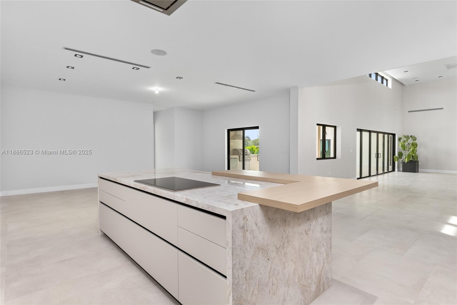 17301 Southwest 52nd Court Southwest Ranches, FL 33331 - Photo 19 of 47 a kitchen with stainless steel appliances granite countertop a sink and a refrigerator