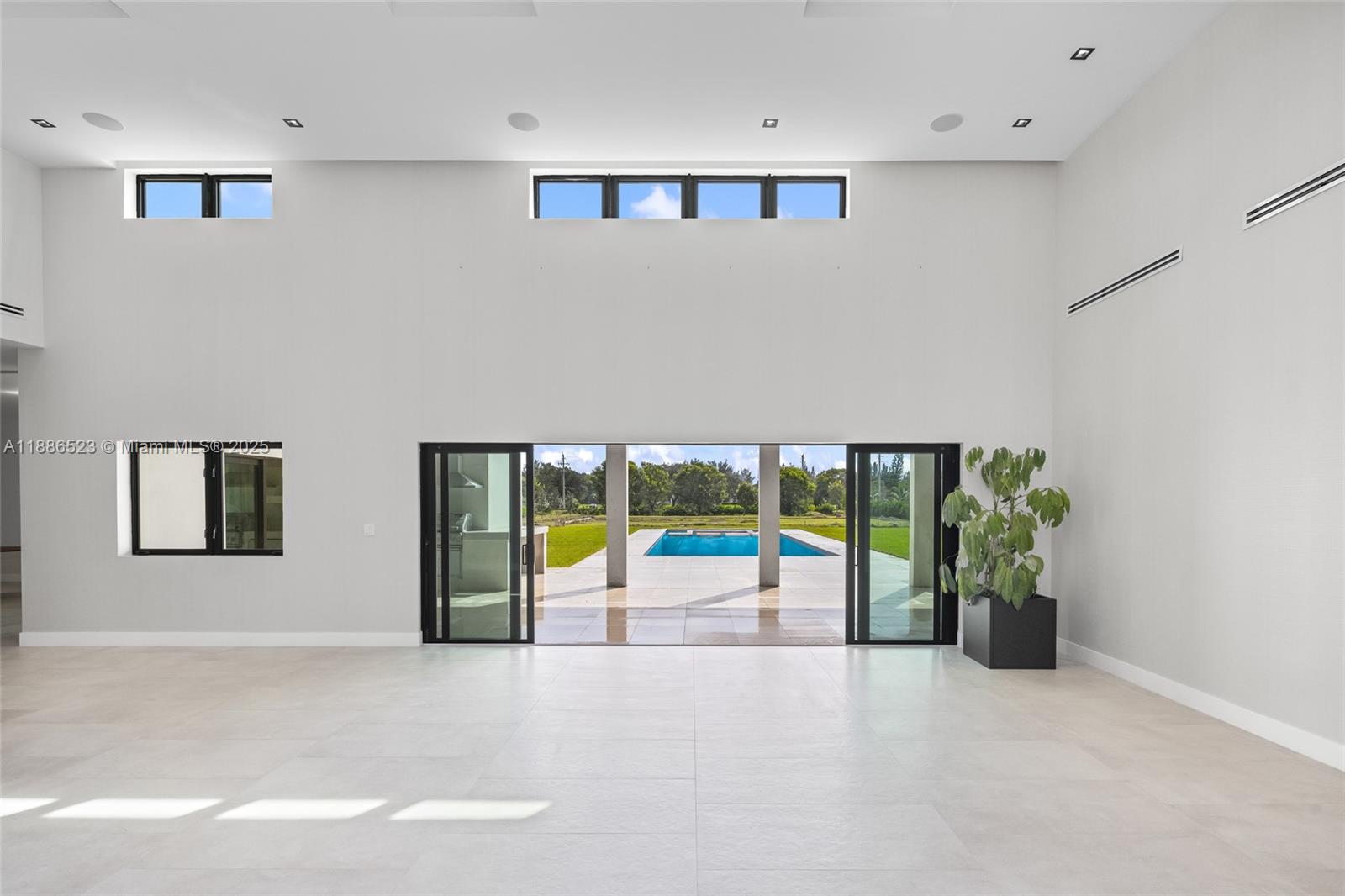 17301 Southwest 52nd Court Southwest Ranches, FL 33331 - Photo 24 of 47 an empty room with floor to ceiling window